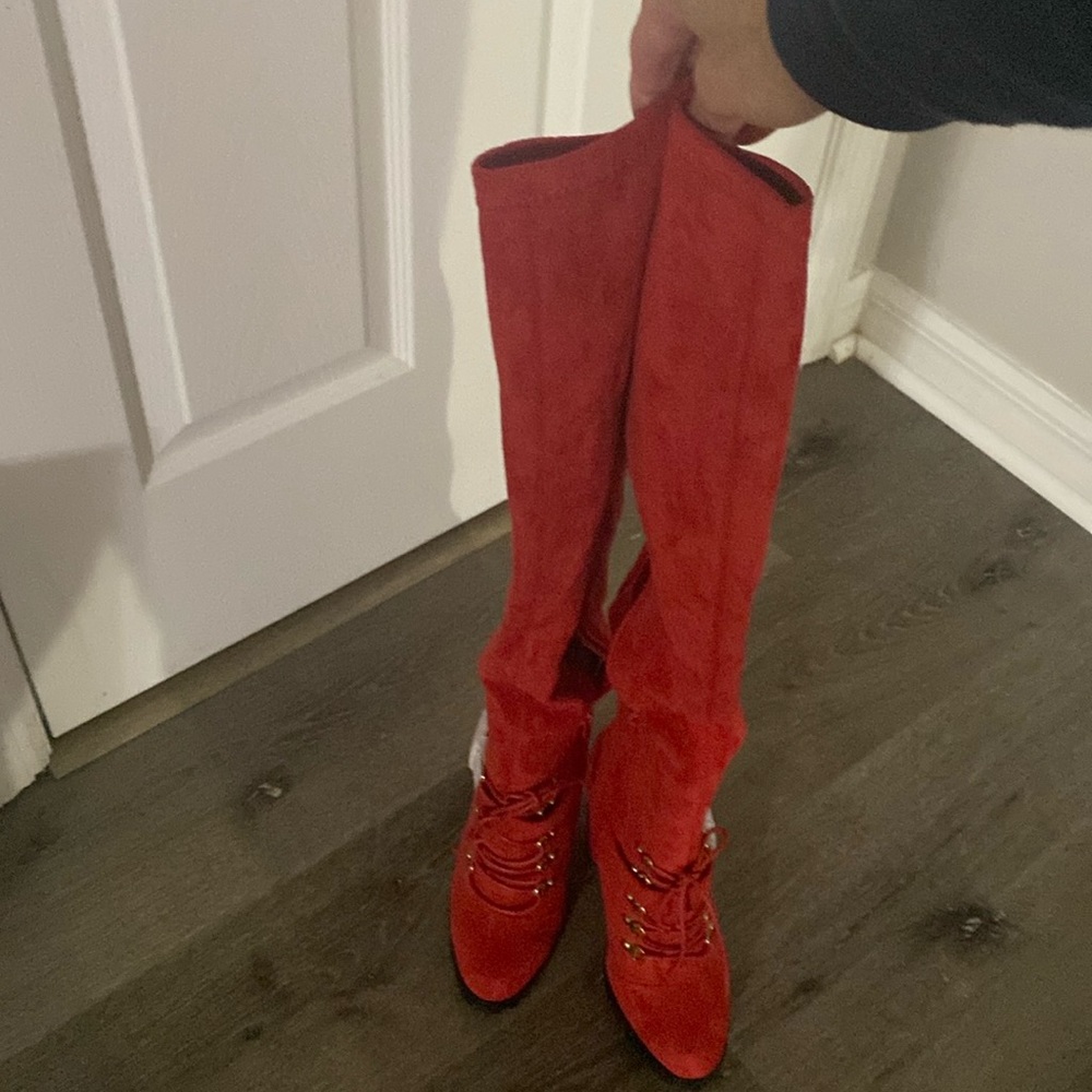 Brand new red thigh high boots with buckles. Very stylish!